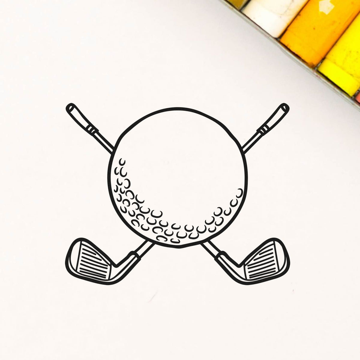 Black golf ball and crossed golf clubs stamp design with yellow and white seal swatches in the corner.