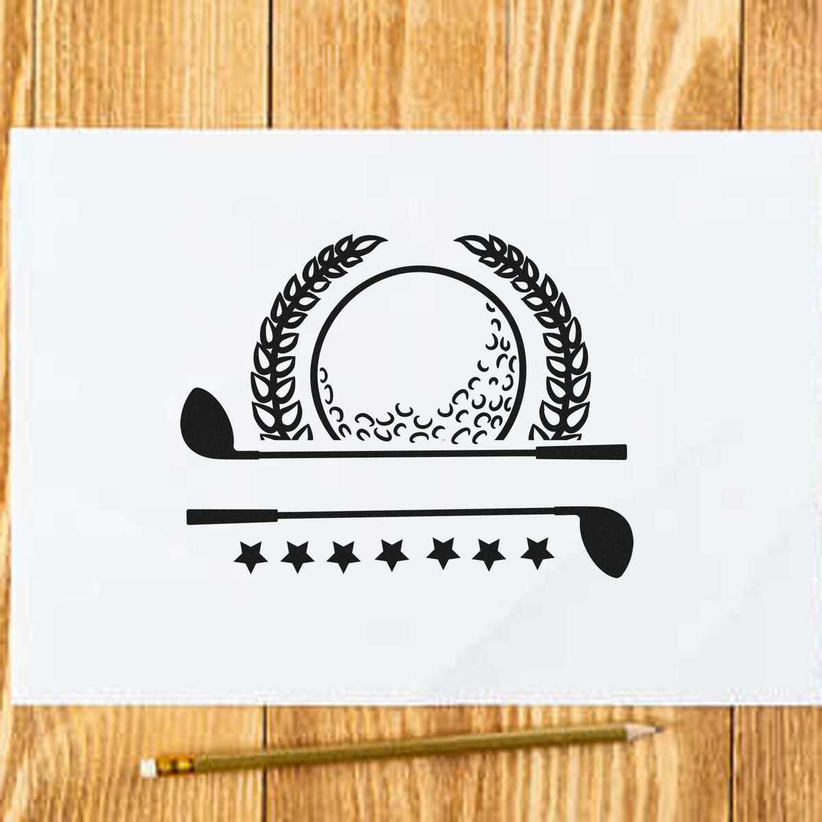 Black golf stamp and seal design with laurel wreath, clubs, and stars on white paper over a wood tabletop.