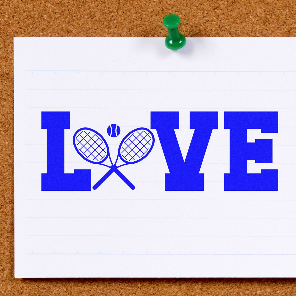 Blue LOVE stamp/seal with tennis rackets as the O, pinned to corkboard with a green pushpin on white paper.