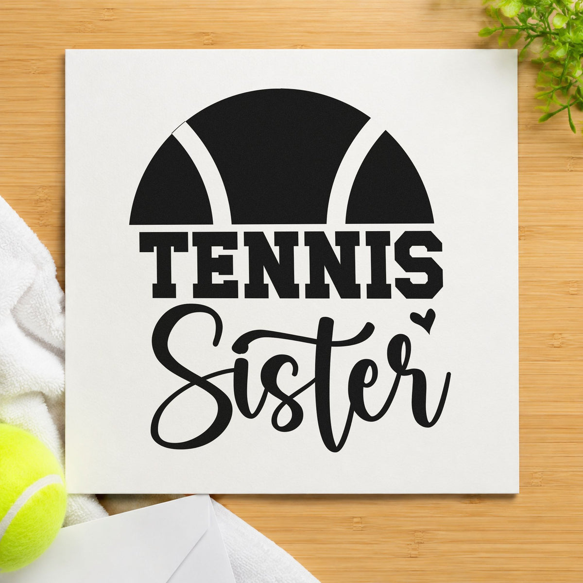 Tennis Sister Half Ball craft stamp imprint in black ink on a handmade project, one idea being court snack gift tags.