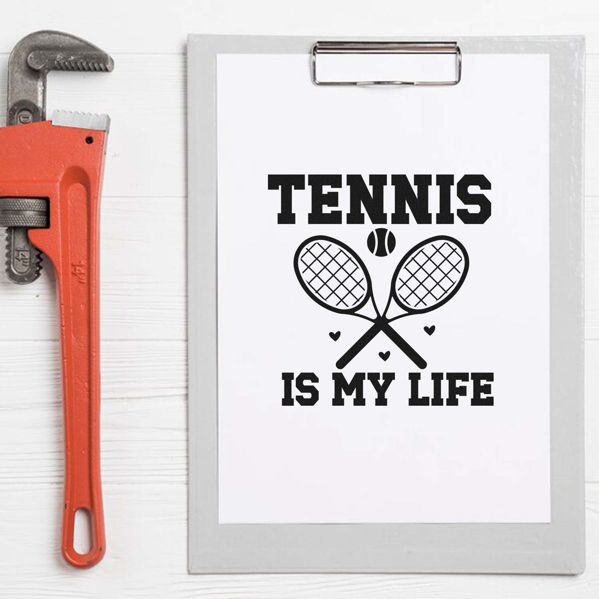 Red stamp and seal tool beside a clipboard with black Tennis Is My Life text, crossed rackets, tennis ball, and hearts.