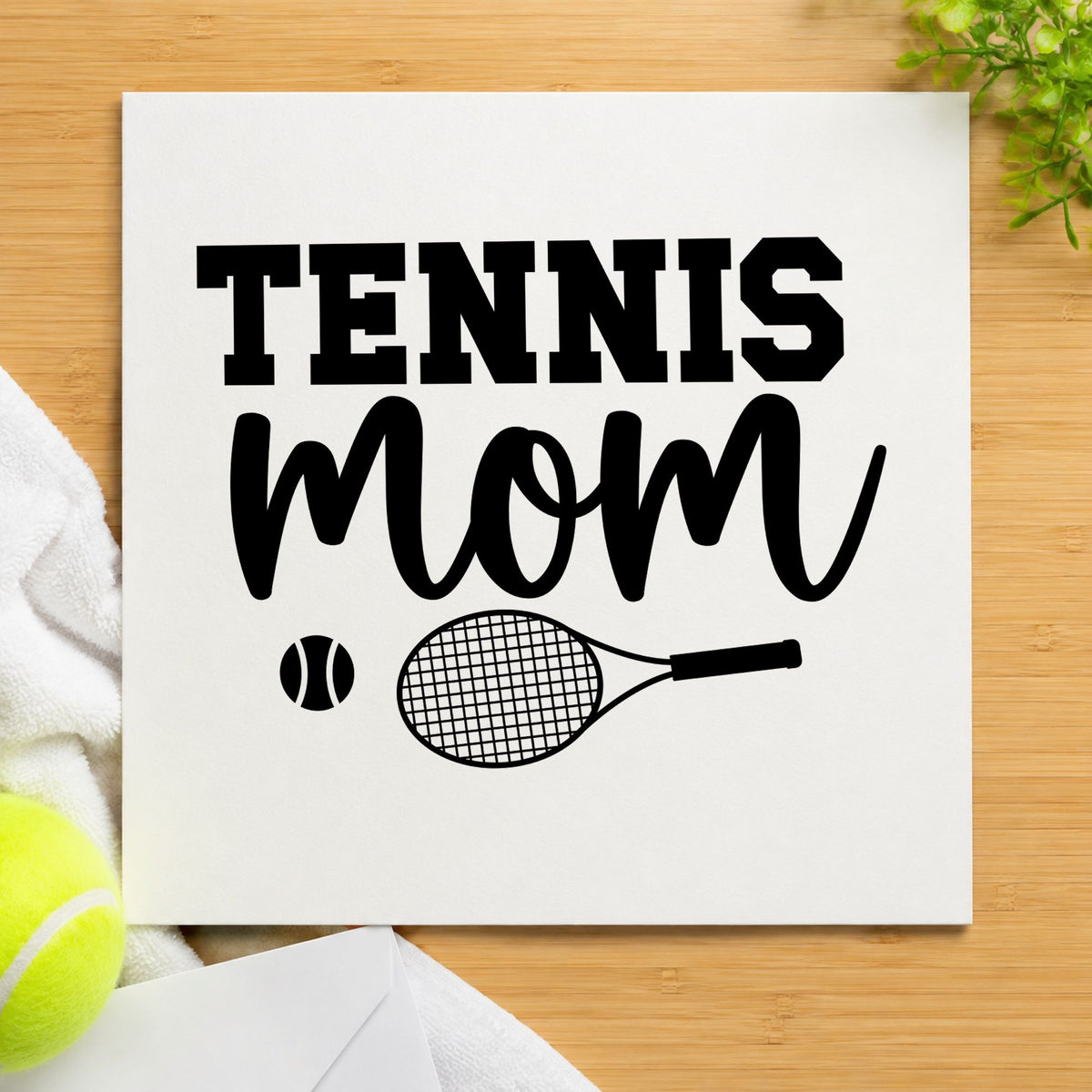 Tennis Mom Racket Ball craft stamp imprint in black ink on a handmade project, one idea being snack tray gift tags.