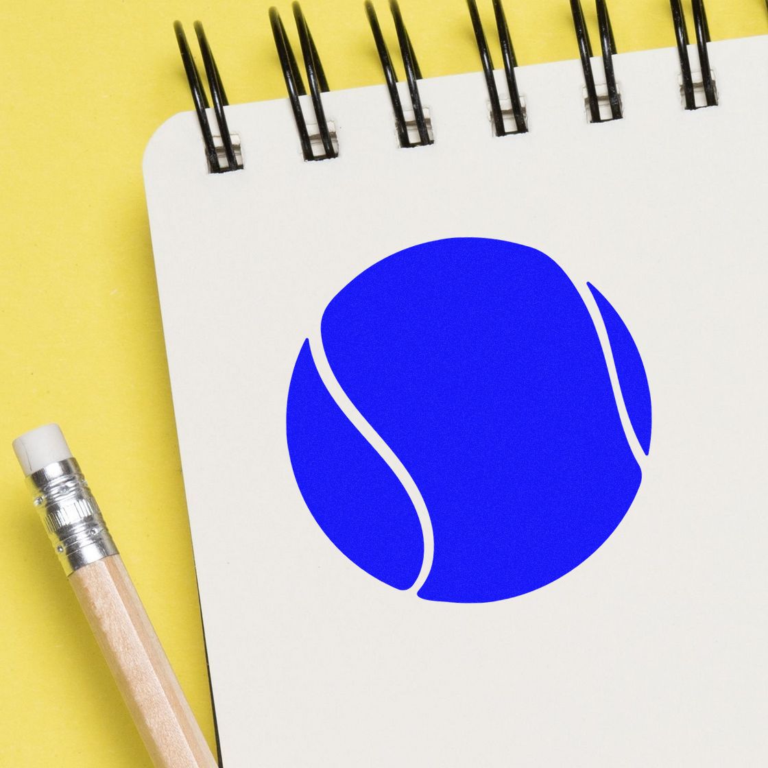 White spiral notepad with a blue stamp seal logo and pencil on a yellow background.