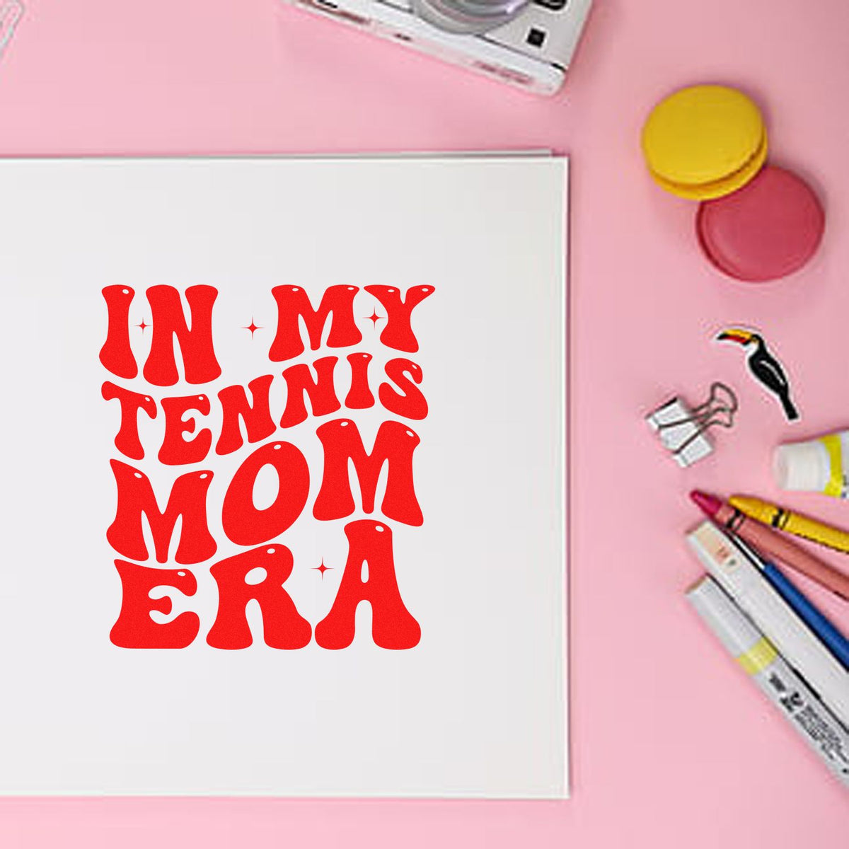 Red In My Tennis Mom Era stamp on white card, with pink background, round seal pads, and markers.