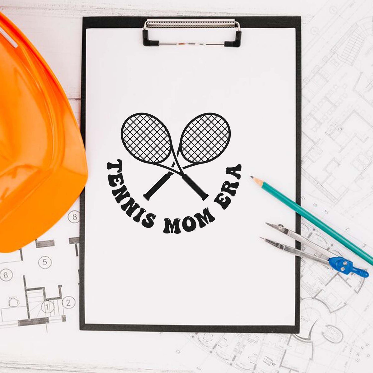Black custom tennis mom stamp seal on white clipboard, with crossed rackets, orange hard hat, and drafting tools.