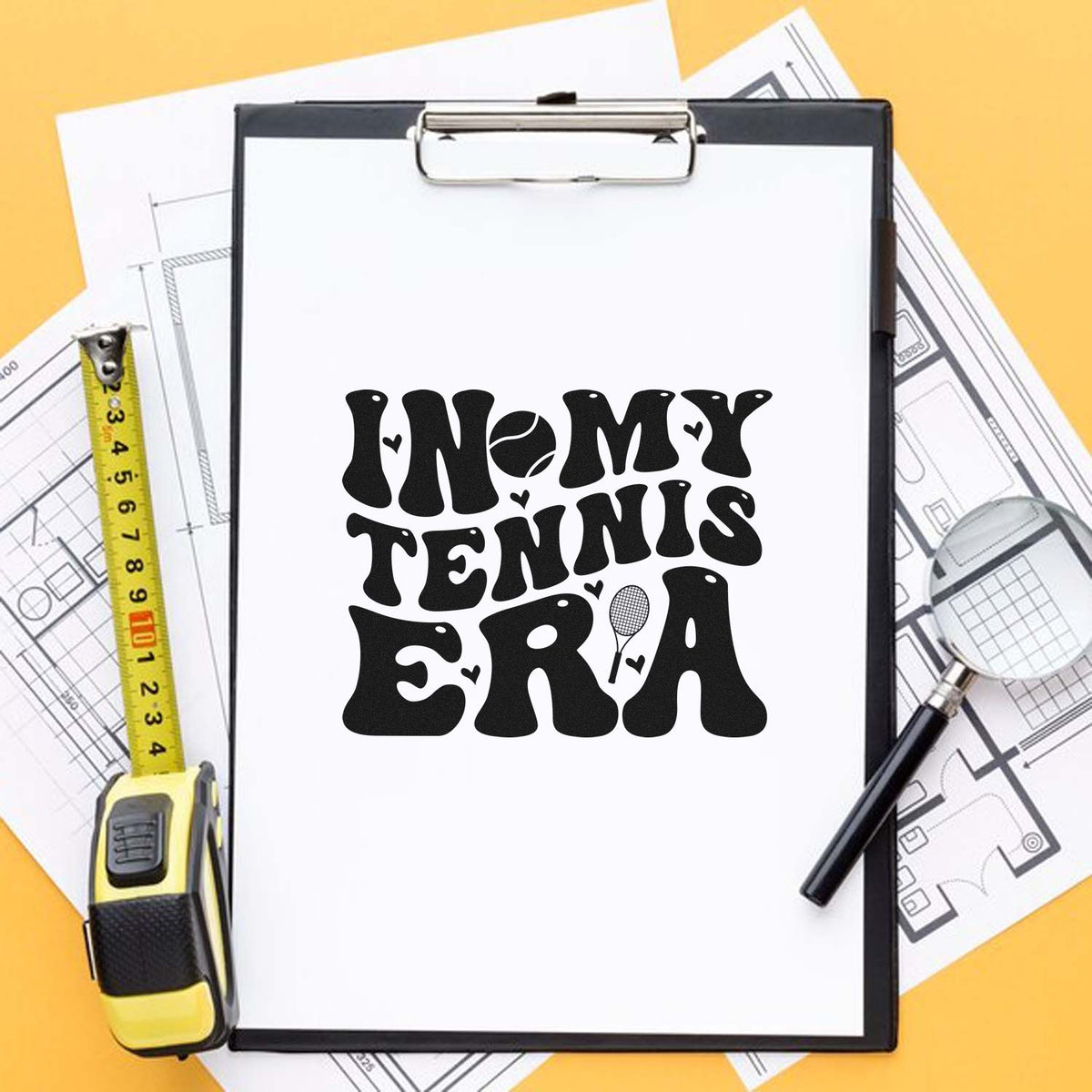 Black tennis-themed custom stamp seal on clipboard, with In My Tennis Era text, tennis ball and racket on yellow background.