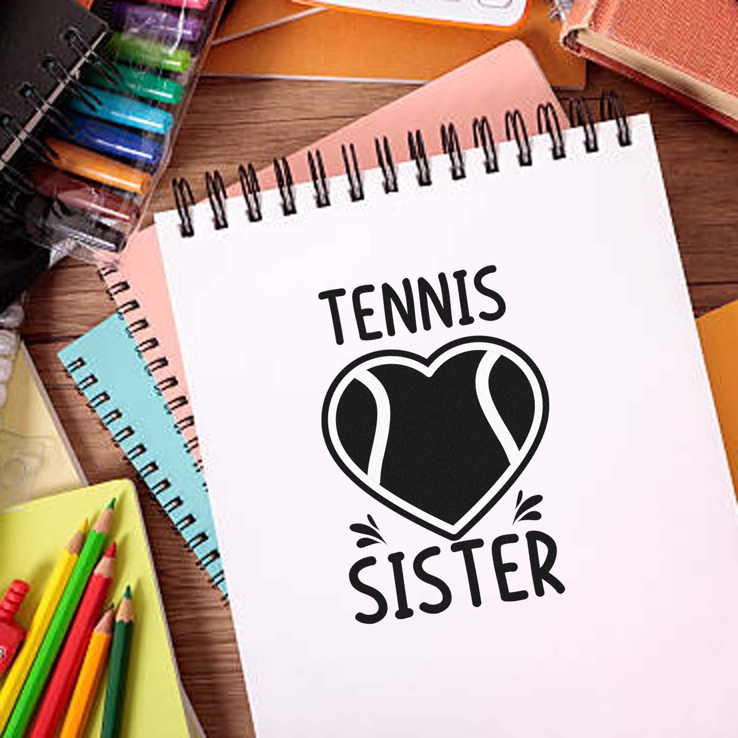 Custom tennis sister stamp and seal on white notebook, black heart emblem, with colorful stationery.