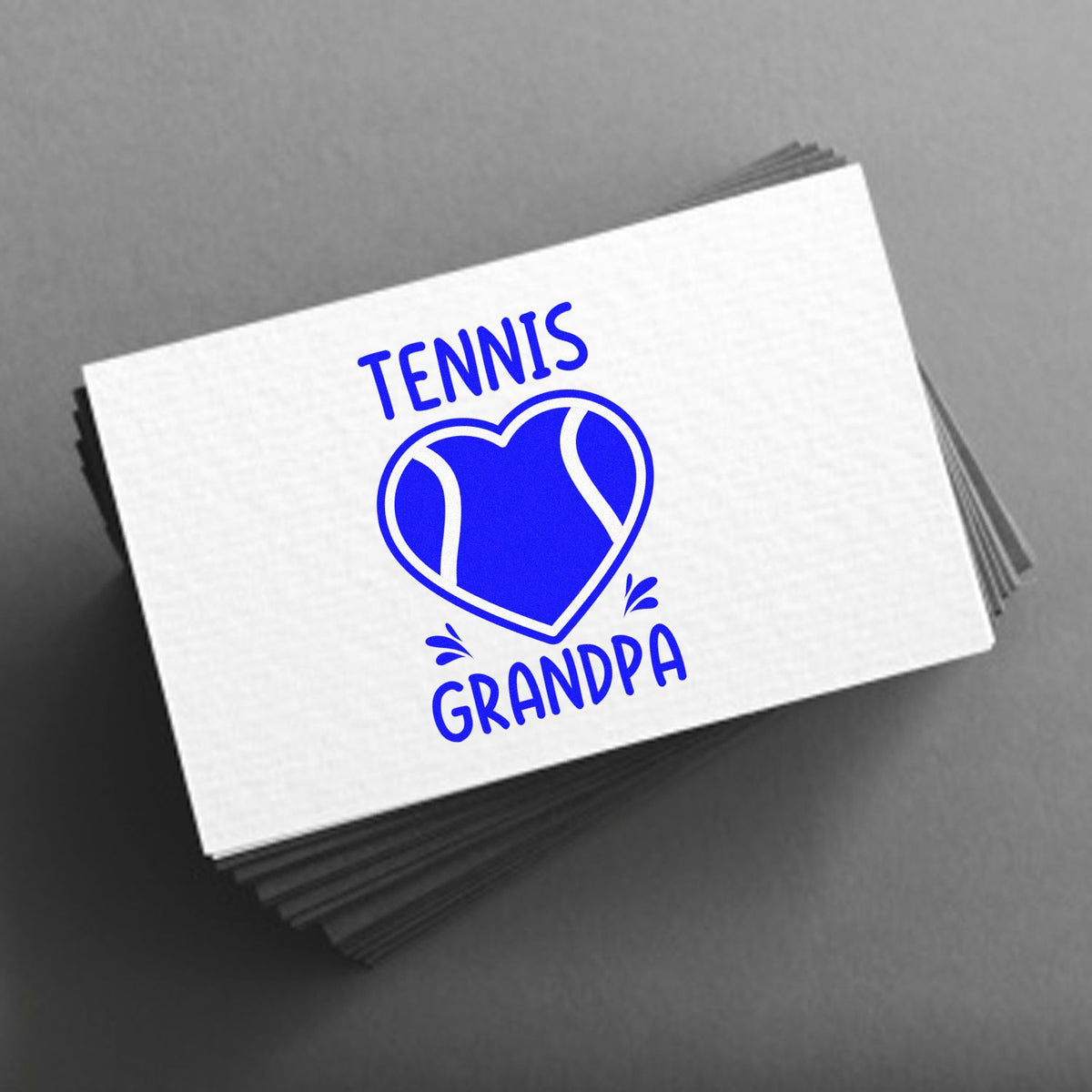 Blue TENNIS GRANDPA heart stamp and seal on white card, stacked on gray background