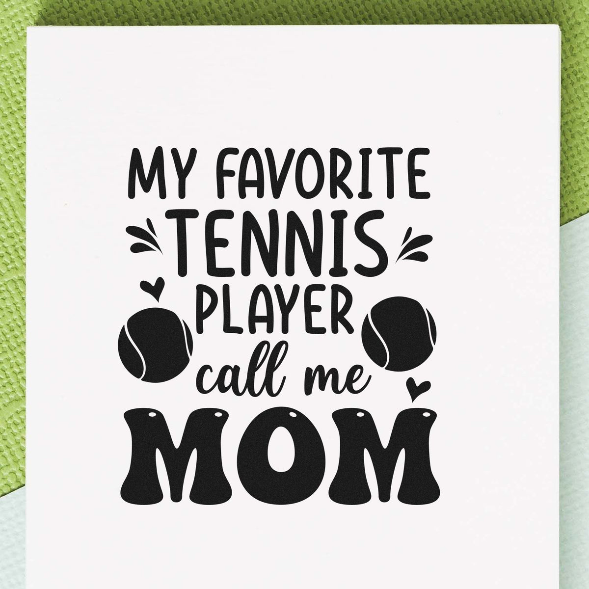 Black custom stamp design reading My Favorite Tennis Player Call Me Mom with tennis balls and hearts on a white background.