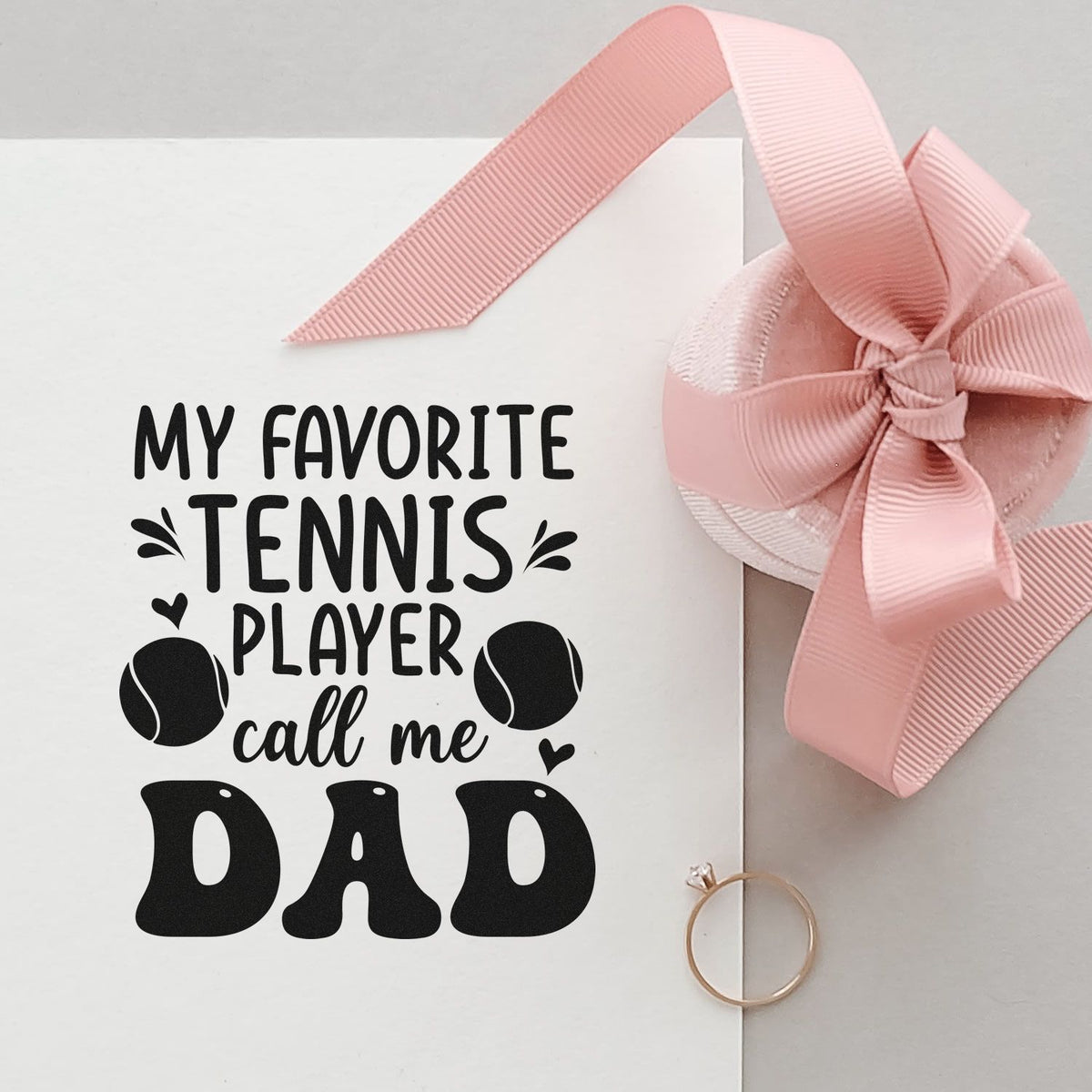Custom pink ribbon seal and black tennis dad stamp on white card with tennis ball graphics