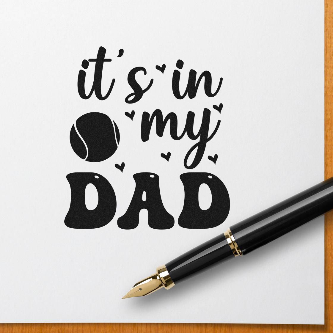 Black tennis-themed stamp seal with its in my dad text, heart accents, and bold lettering on white paper.