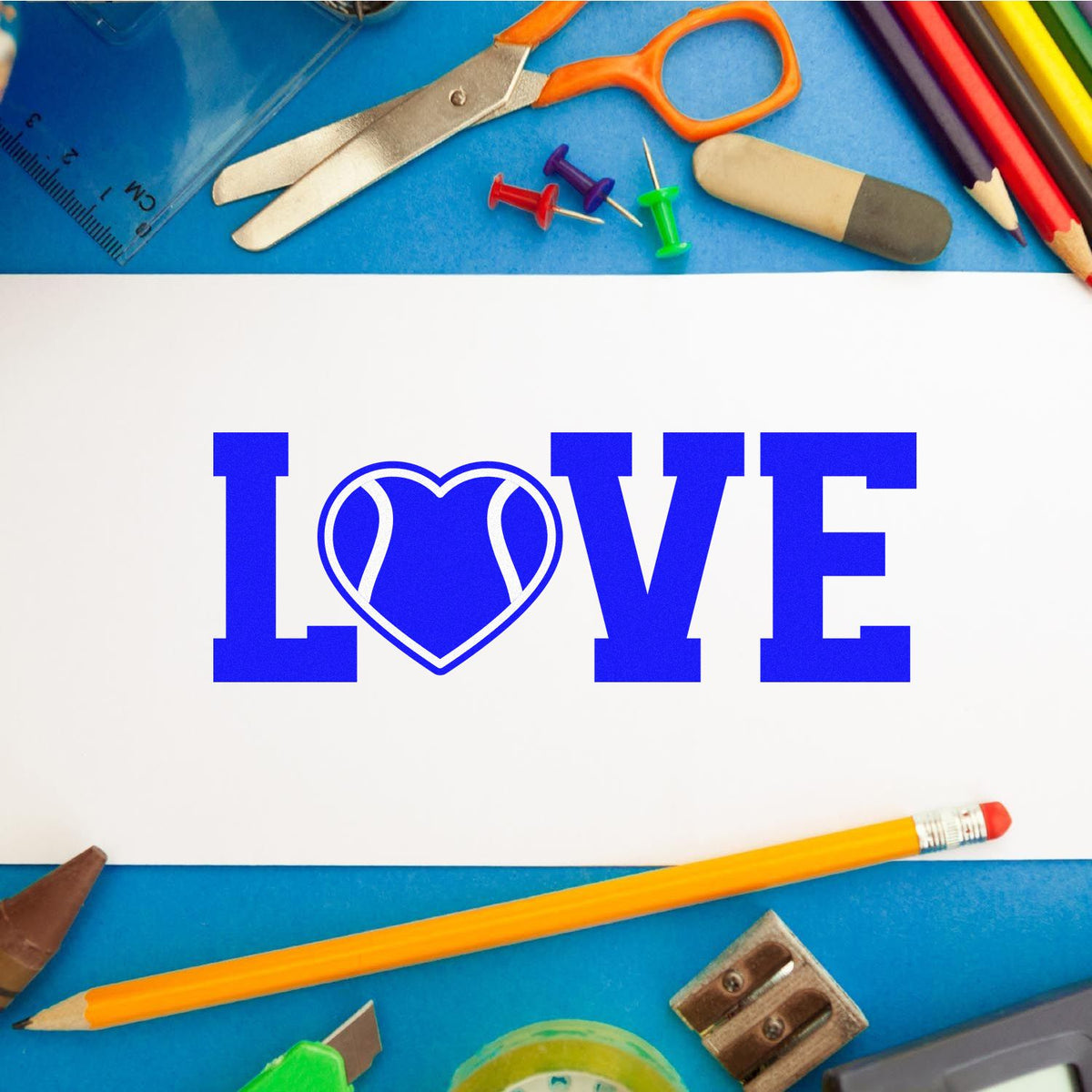 Blue LOVE stamp-and-seal design with heart O, surrounded by colorful stationery on a blue background.