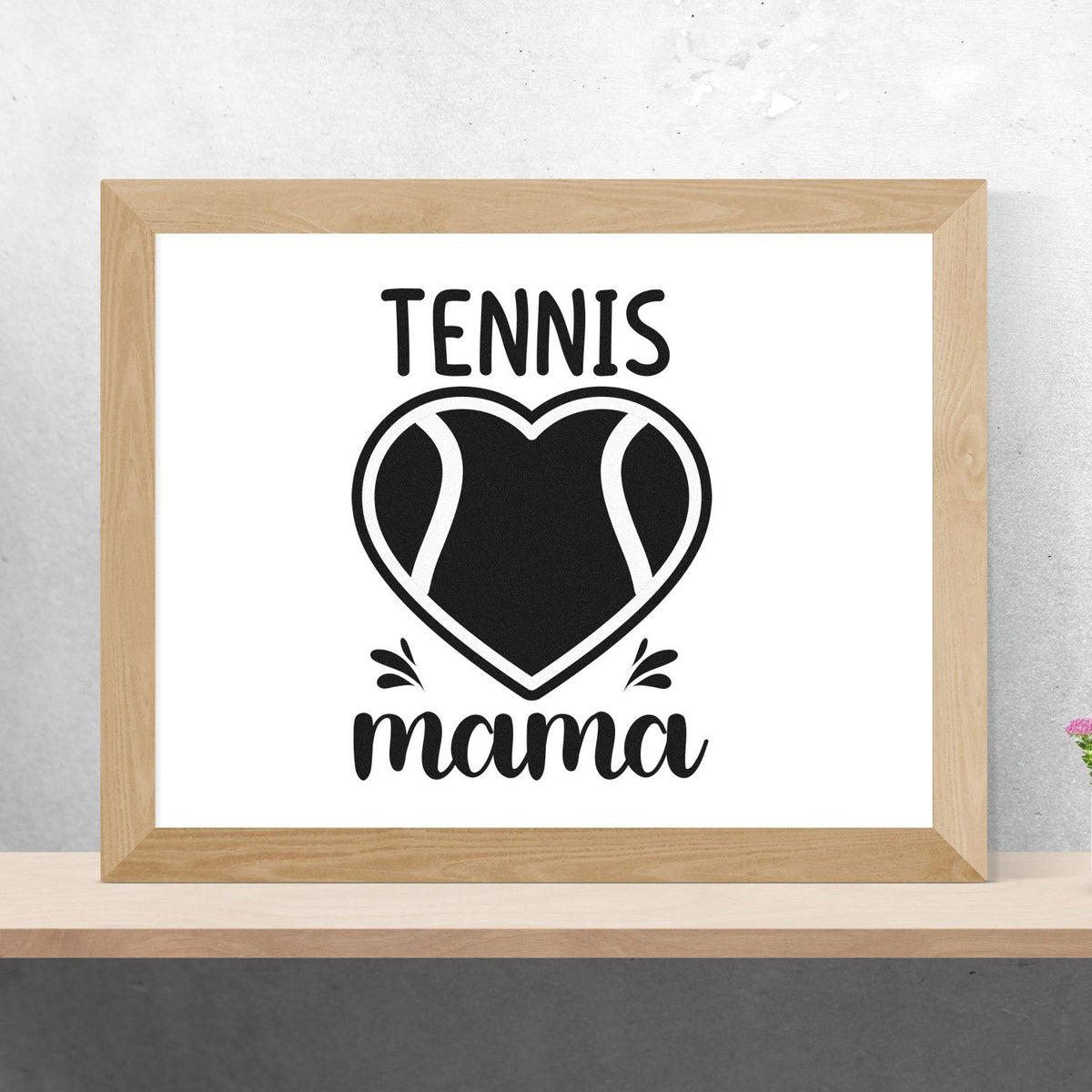 Black tennis mama heart stamp and seal design in a natural wood frame on a white background