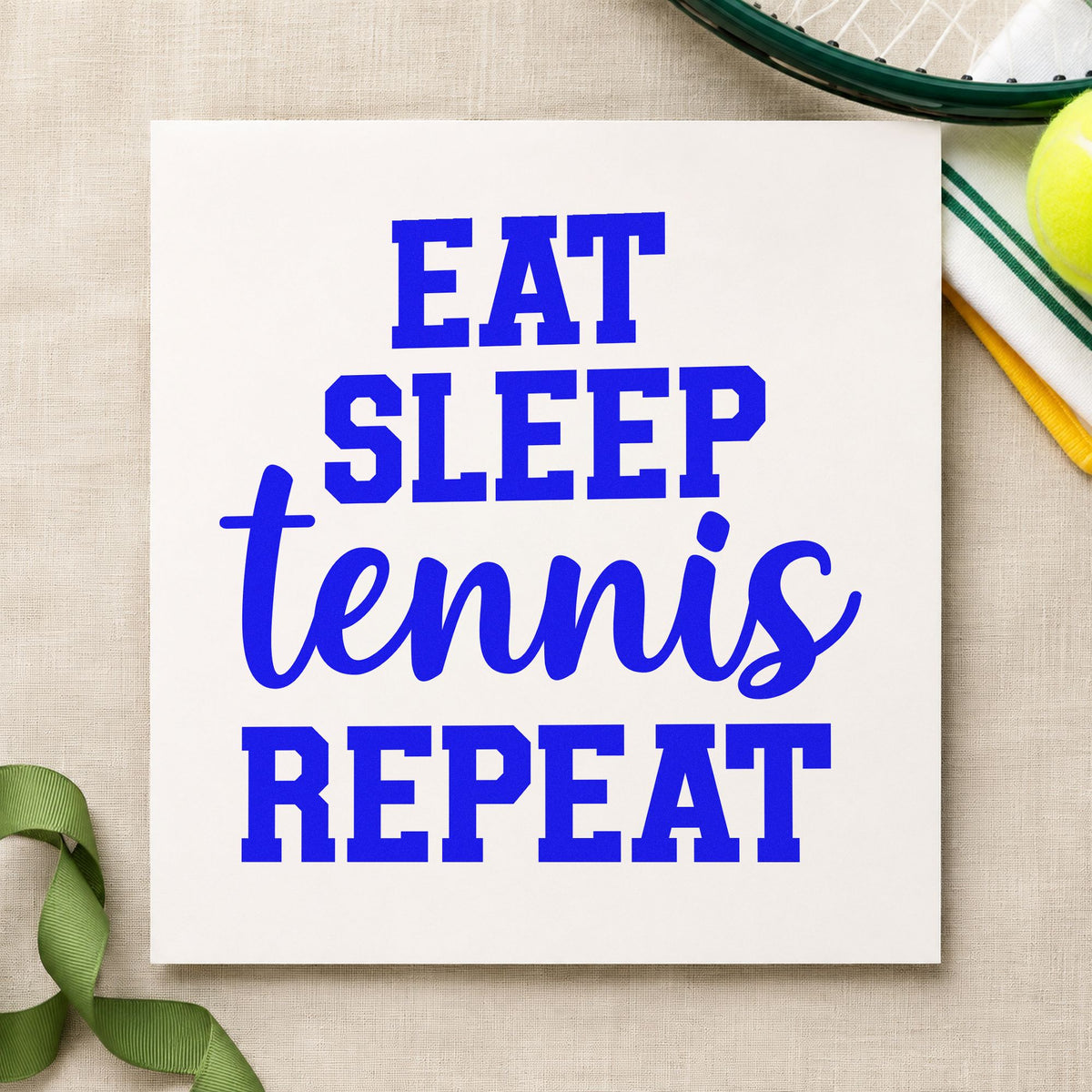 Eat Sleep Tennis Repeat craft stamp in blue ink on cardstock, an easy option for kit bag printing.