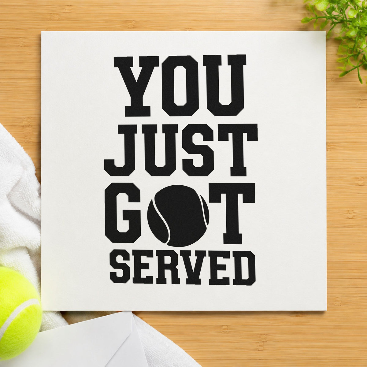 You Just Got Served craft stamp imprint in black ink on a handmade project, one idea being travelling award tags.