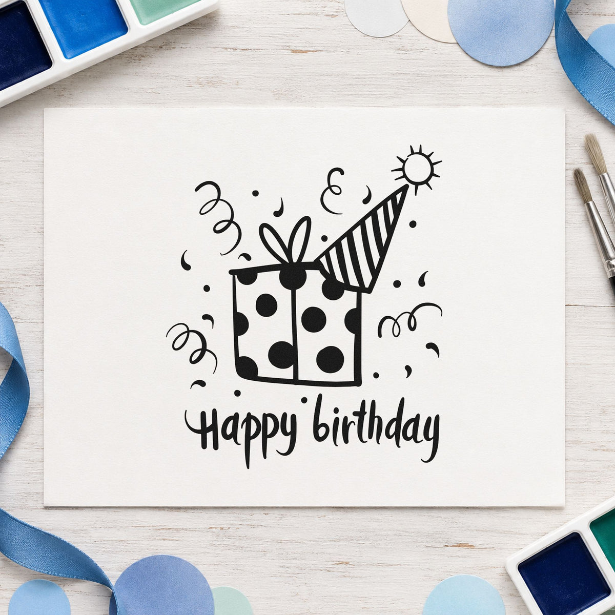 Birthday Gift Party Hat craft stamp imprint in black ink on a handmade project, one idea being favor bag gift tags.