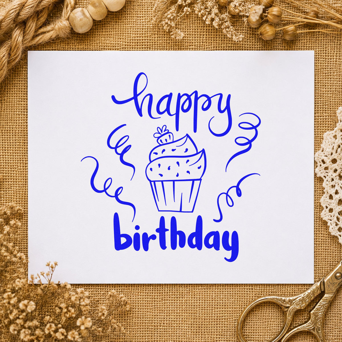 Happy Birthday Cupcake Streamers craft stamp in blue ink on cardstock, an easy option for baker apron printing.