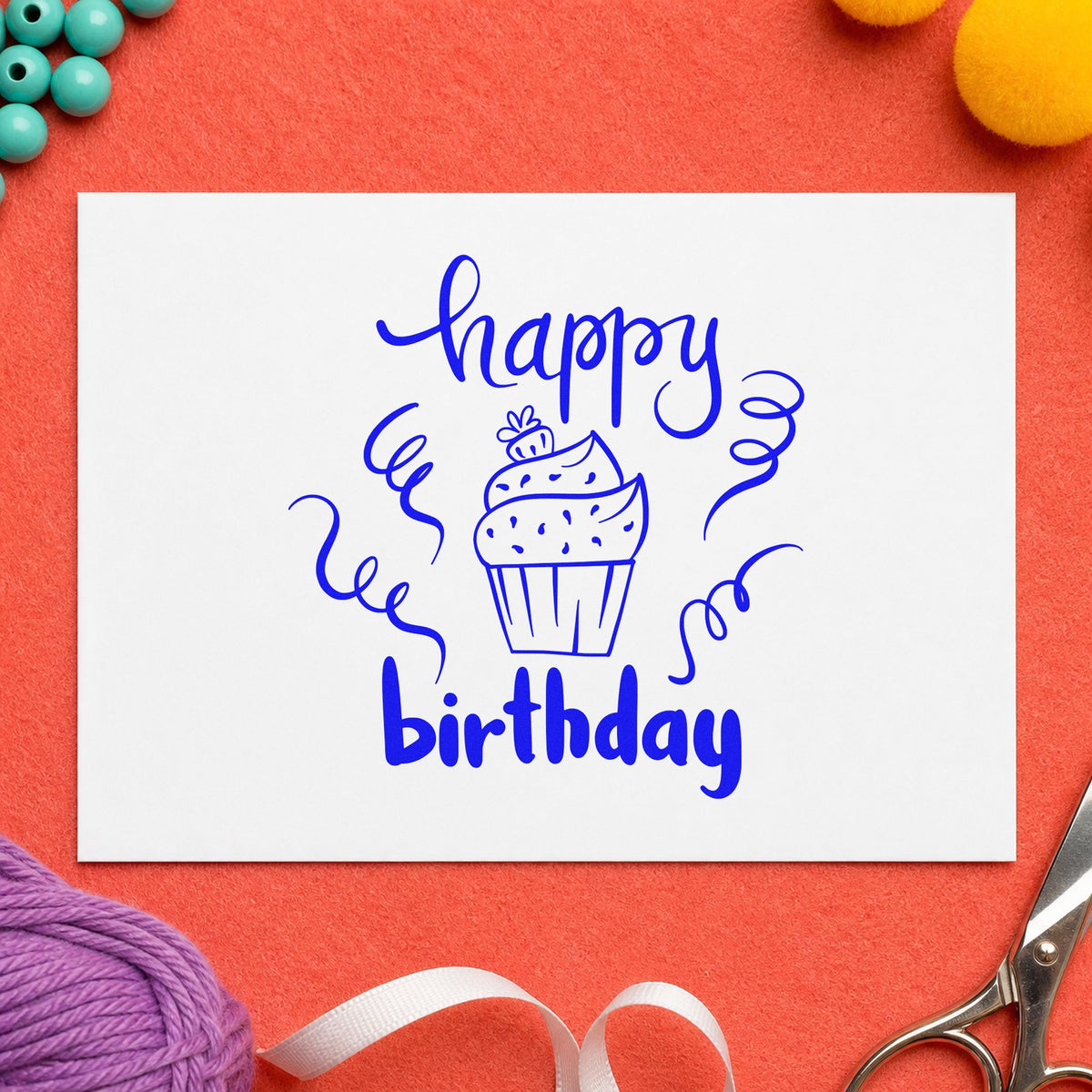 Happy Birthday Cupcake Streamers craft stamp imprinted in blue ink on paper, a design suited to framed shop counter.