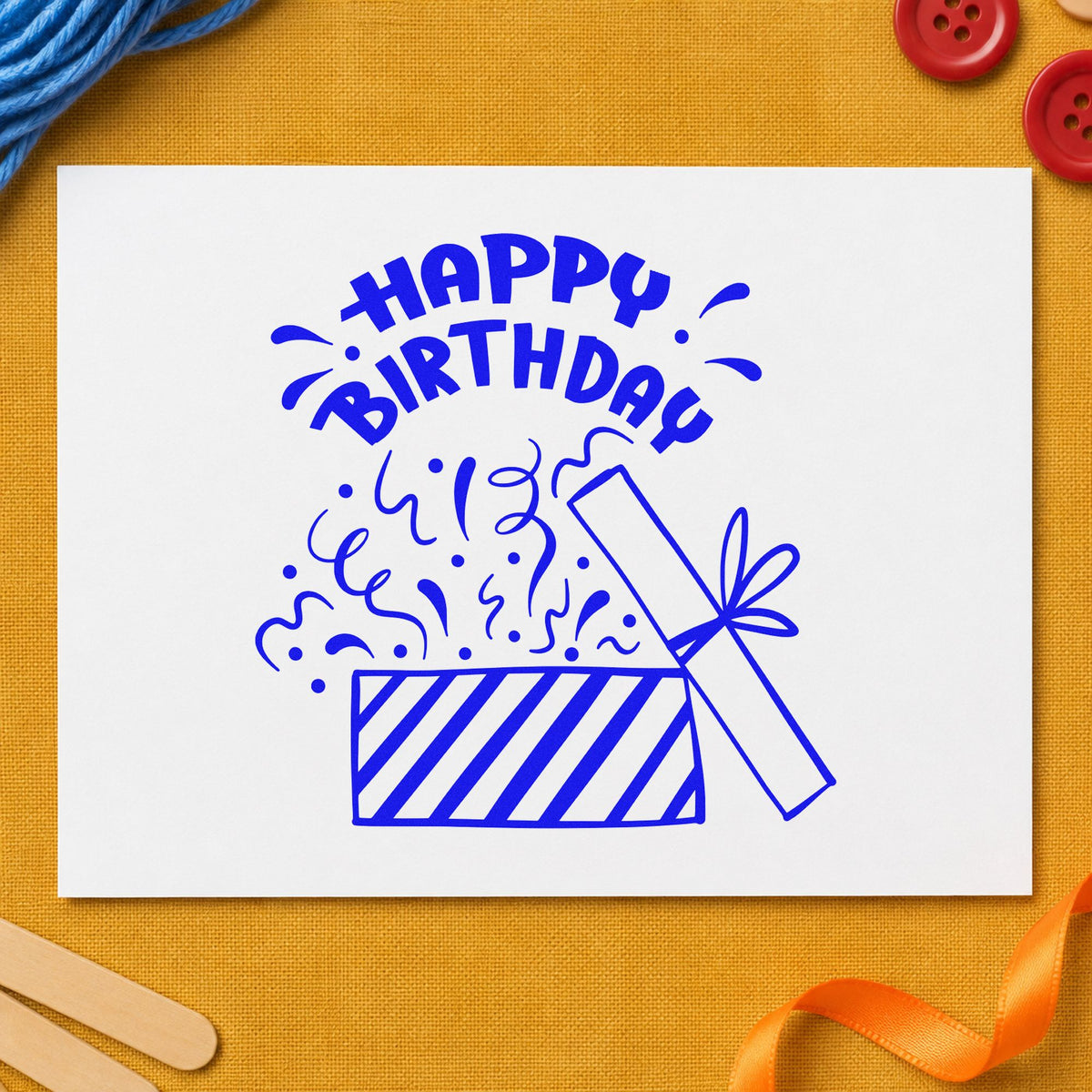 Birthday Open Gift Confetti craft stamp in blue ink on cardstock, an easy option for wrap cloth printing.