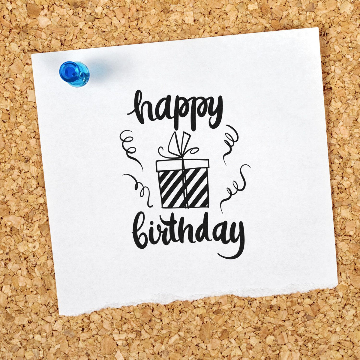Black birthday stamp and seal design with gift icon, confetti curls, on white paper pinned with a blue pushpin.
