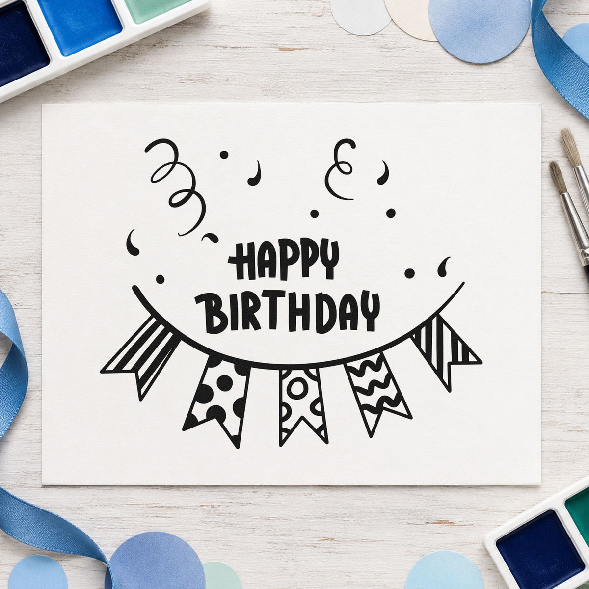 Birthday Patterned Pennant Bunting craft stamp imprint in black ink on a handmade project, one idea being cake box gift tags.