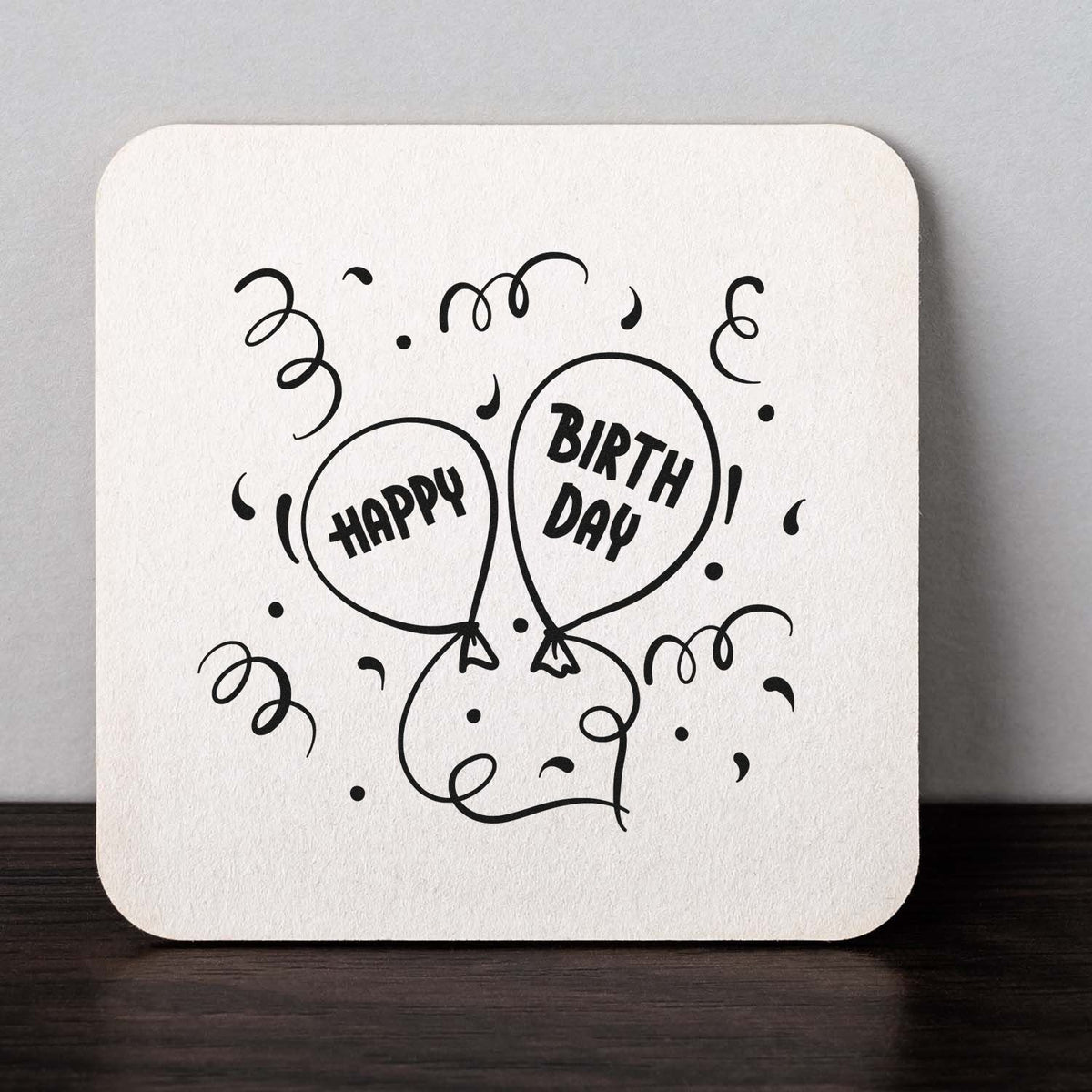 Black Happy Birthday balloon stamp and confetti seal on a white square card