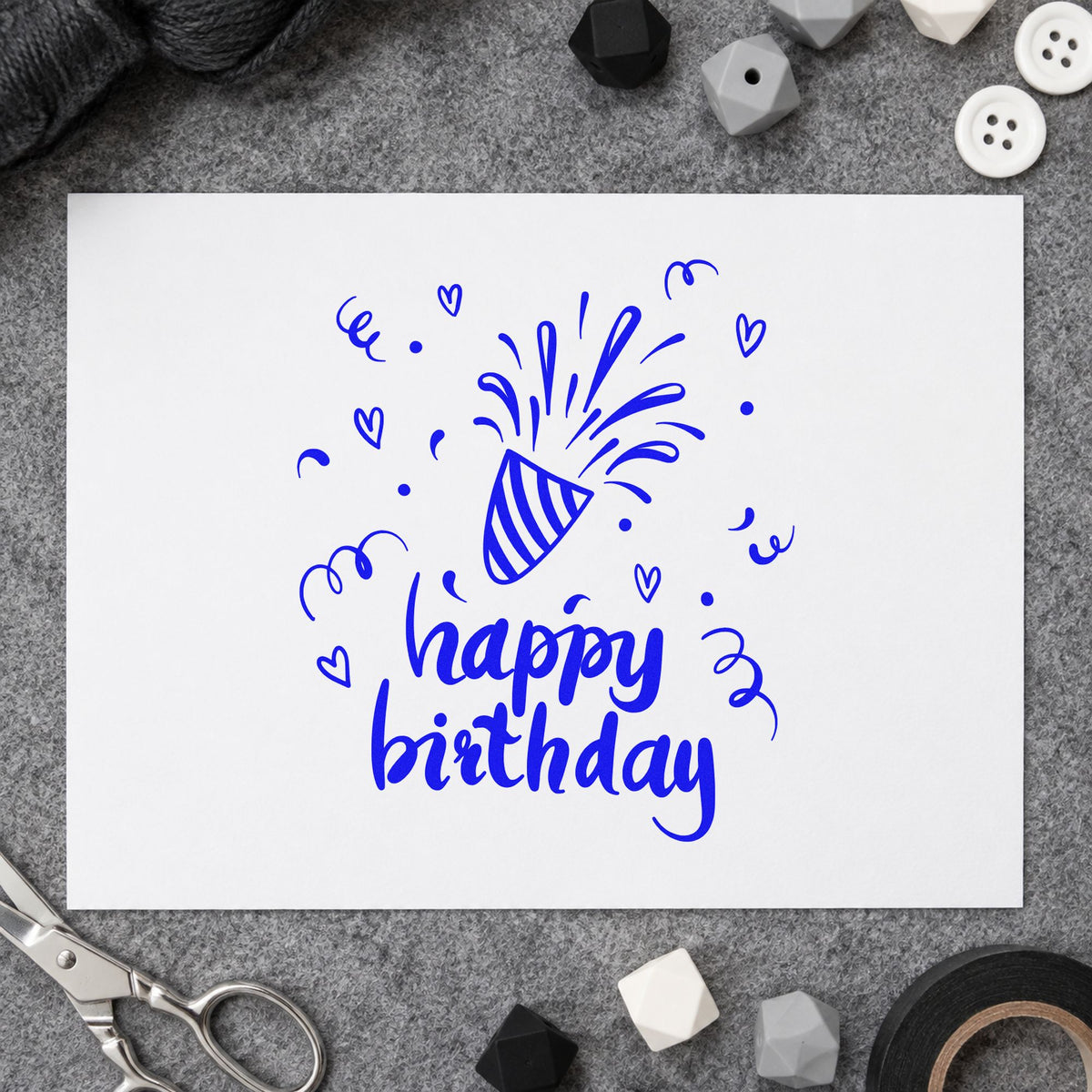 Birthday Bursting Party Popper craft stamp in blue ink on cardstock, an easy option for table runner printing.