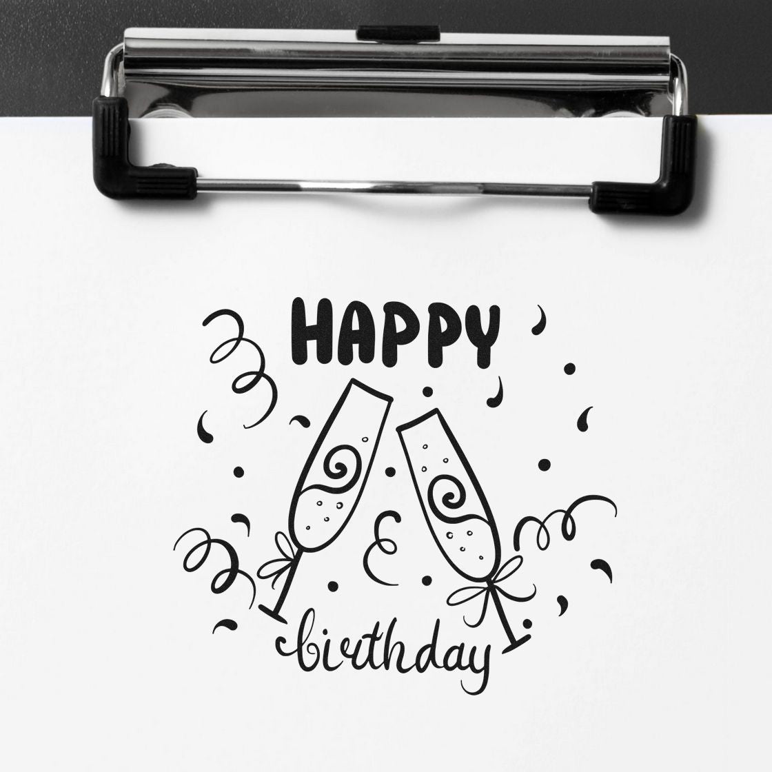 Black birthday stamp and seal design with champagne glasses, confetti, and Happy birthday on white paper.