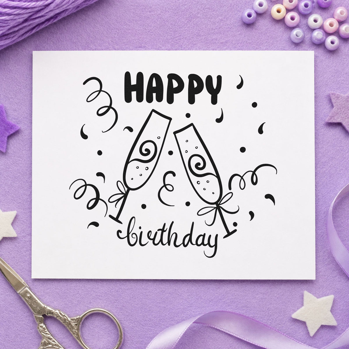 Birthday Toast Champagne Flutes craft stamp imprint in black ink on a handmade project, one idea being favor glass gift tags.