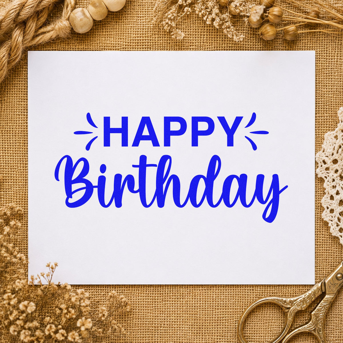 Happy Birthday Accent Script craft stamp in blue ink on cardstock, an easy option for towel hem printing.