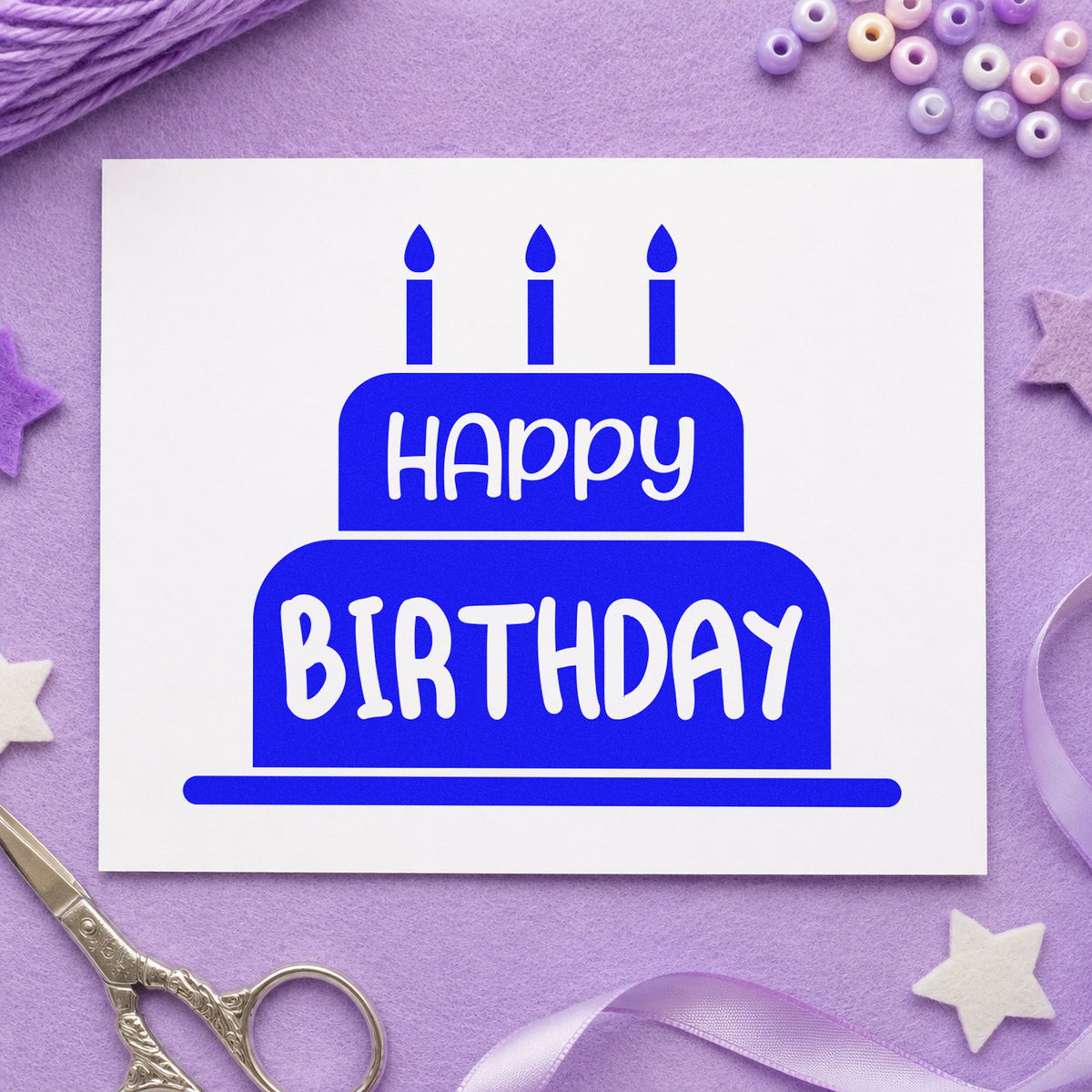 Happy Birthday Candle Cake craft stamp in blue ink on cardstock, an easy option for decorating apron printing.