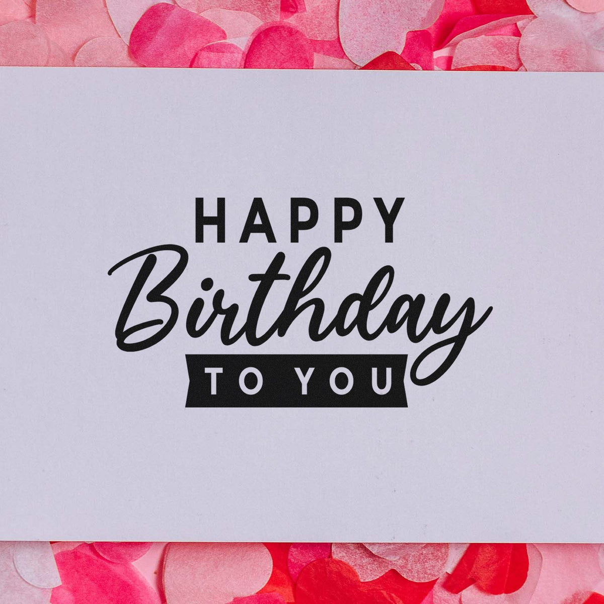 Black Happy Birthday to You stamp on white card, framed by pink confetti for stamp and seal products