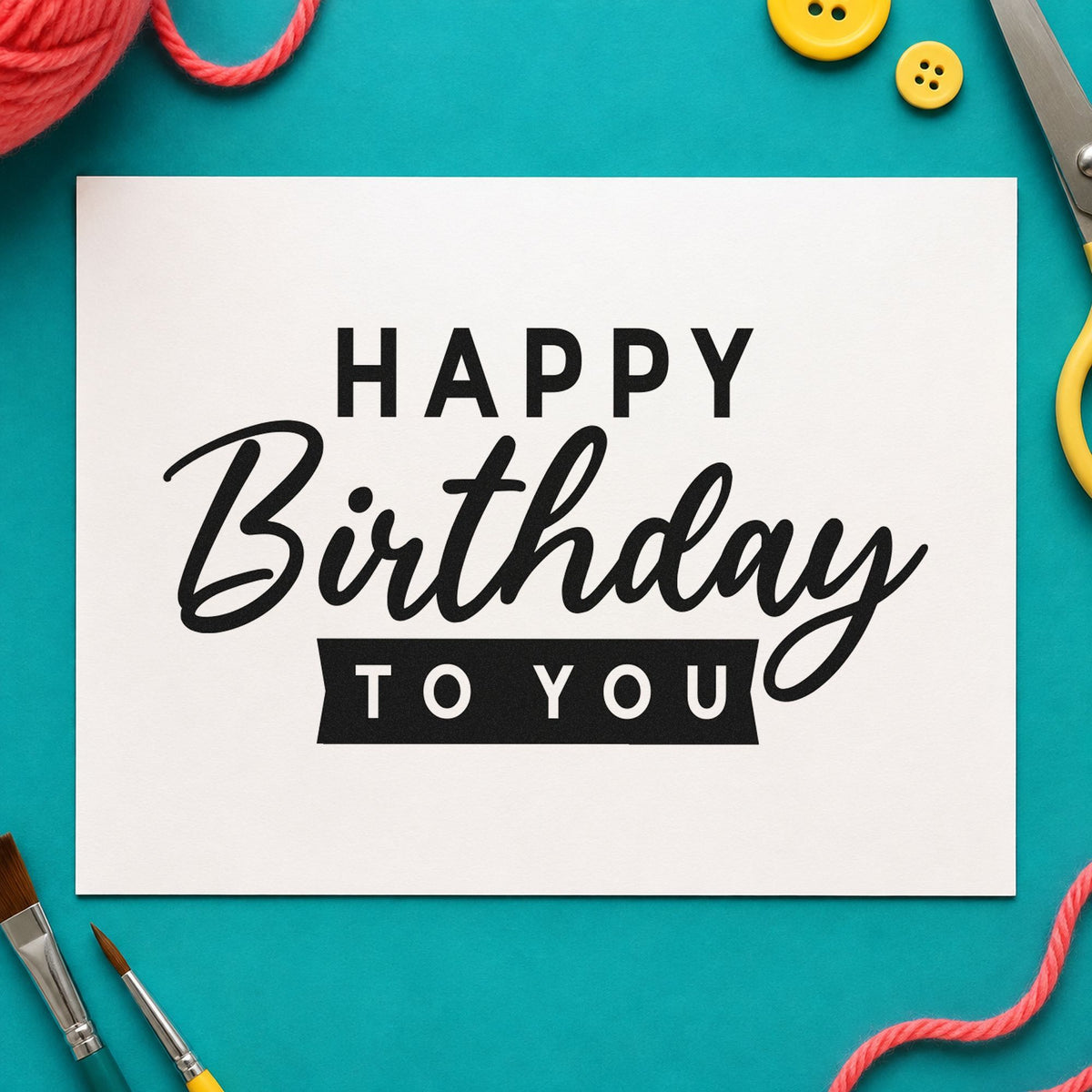Happy Birthday To You craft stamp imprint in black ink on a handmade project, one idea being window sign gift tags.
