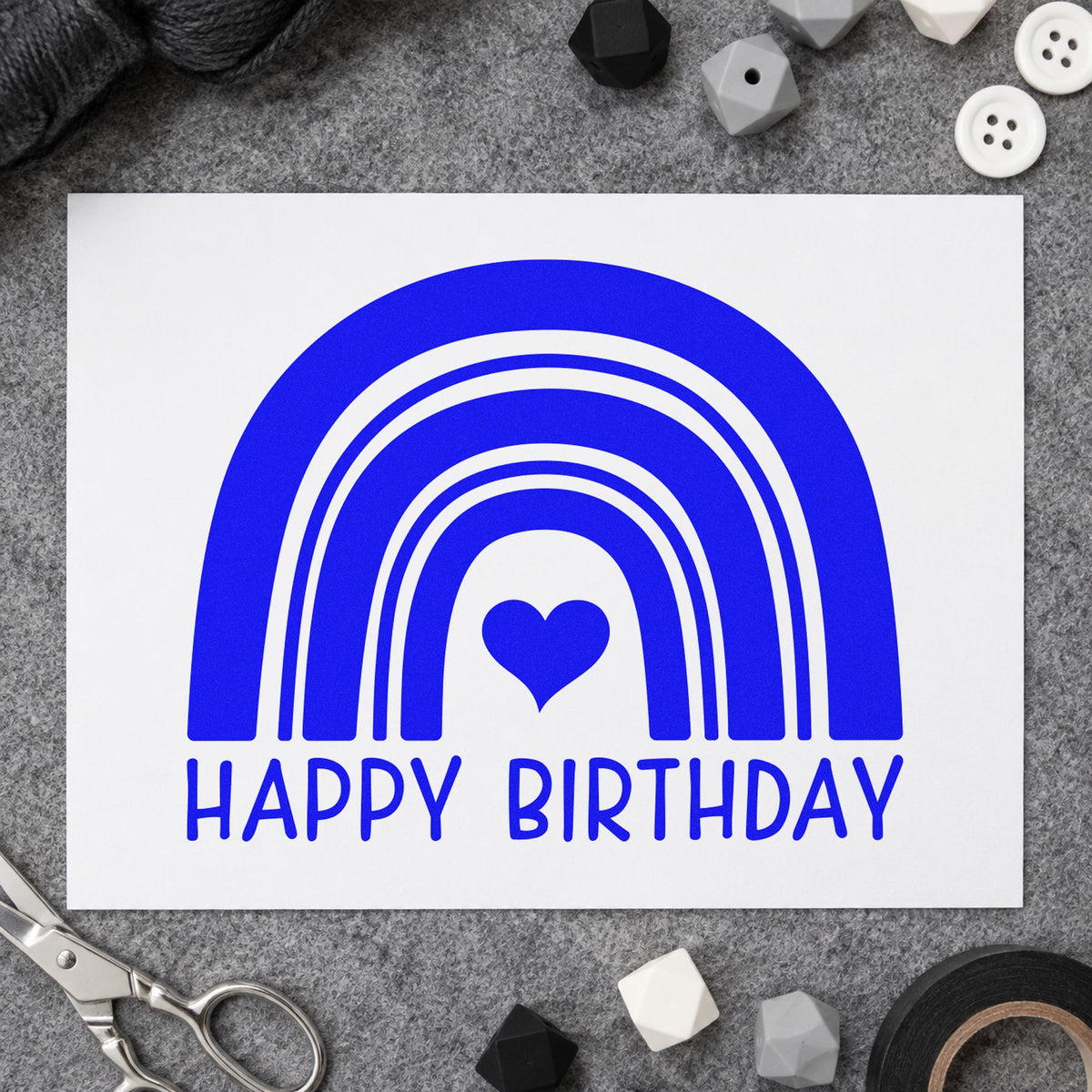 Happy Birthday Heart Rainbow craft stamp in blue ink on cardstock, an easy option for table runner printing.