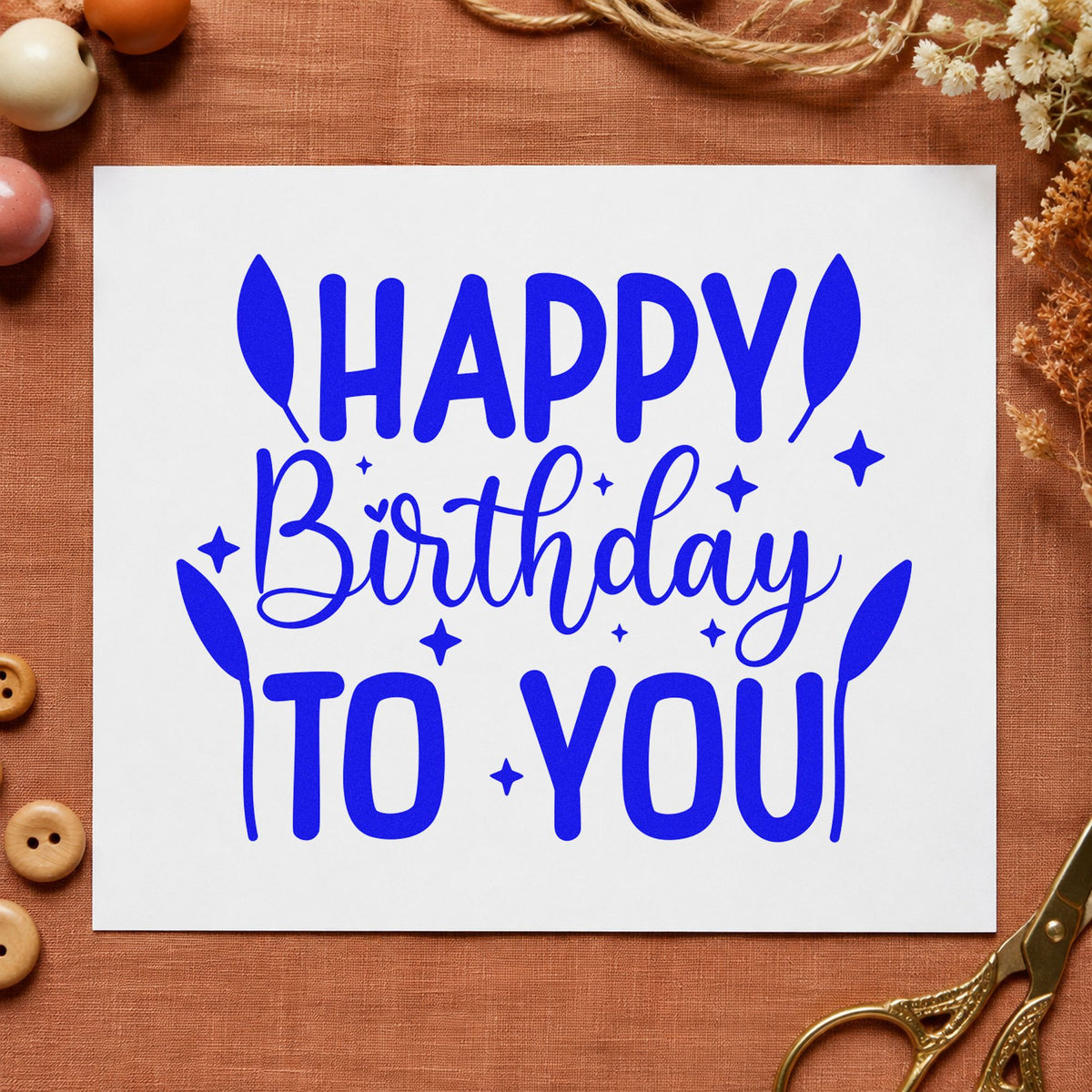 Happy Birthday To You craft stamp imprinted in blue ink on paper, a design suited to framed desk corner.