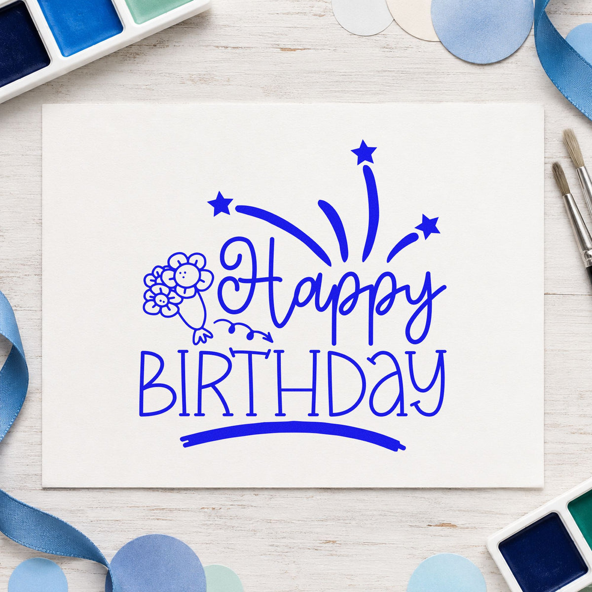 Happy Birthday Flowers Fireworks craft stamp in blue ink on cardstock, an easy option for wrap cloth printing.