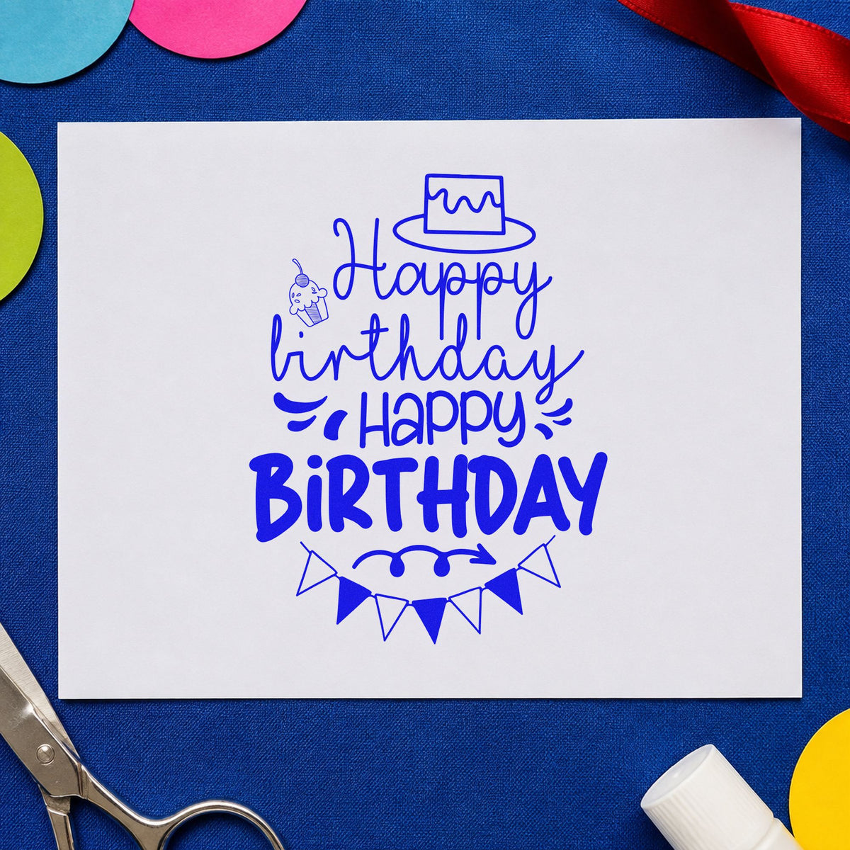 Repeated Birthday Cake Bunting craft stamp in blue ink on cardstock, an easy option for booth curtain printing.