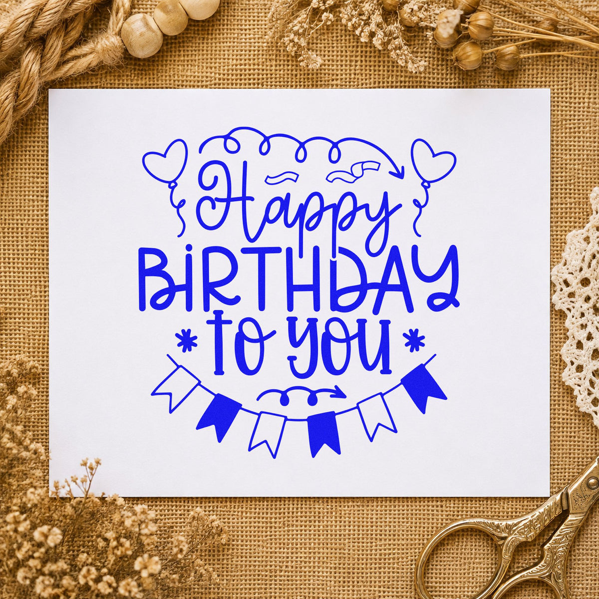 Happy Birthday Heart Balloons craft stamp in blue ink on cardstock, an easy option for bed throw printing.
