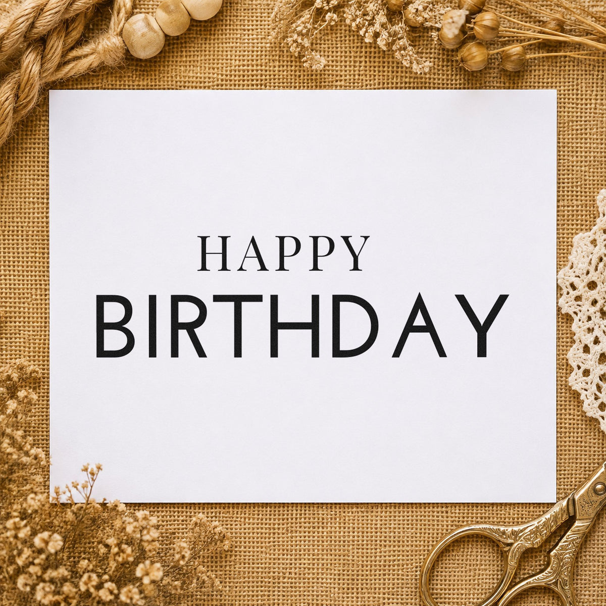 Simple Happy Birthday Capitals craft stamp imprint in black ink on a handmade project, one idea being place gift tags.