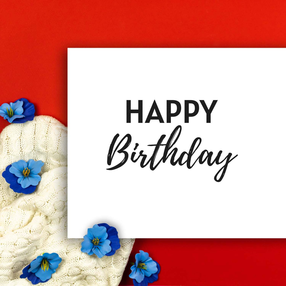Happy Birthday stamp and seal on white card, with black lettering, red background, cream knit fabric, and blue flowers.