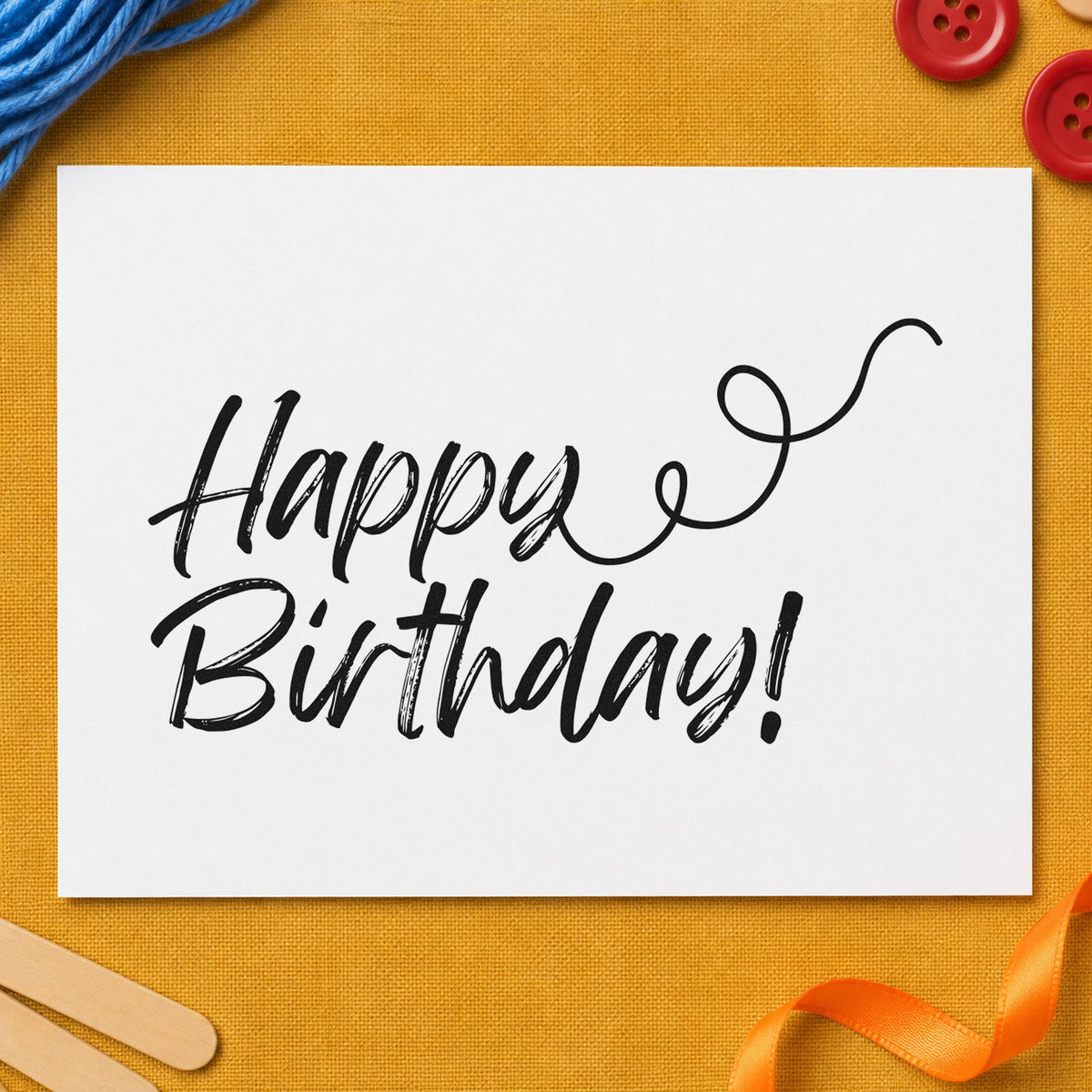 Happy Birthday Curl Flourish craft stamp imprint in black ink on a handmade project, one idea being pen set gift tags.
