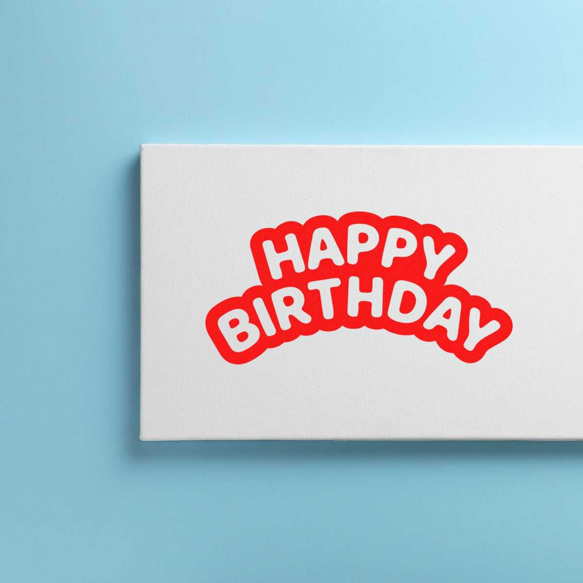 White stamp and seal package with red HAPPY BIRTHDAY lettering on a light blue background.