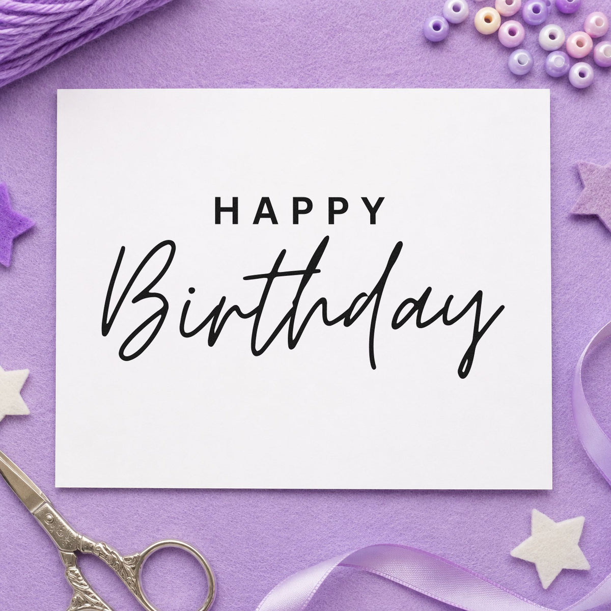 Happy Birthday Spaced Capitals craft stamp imprint in black ink on a handmade project, one idea being issue bundle tags.
