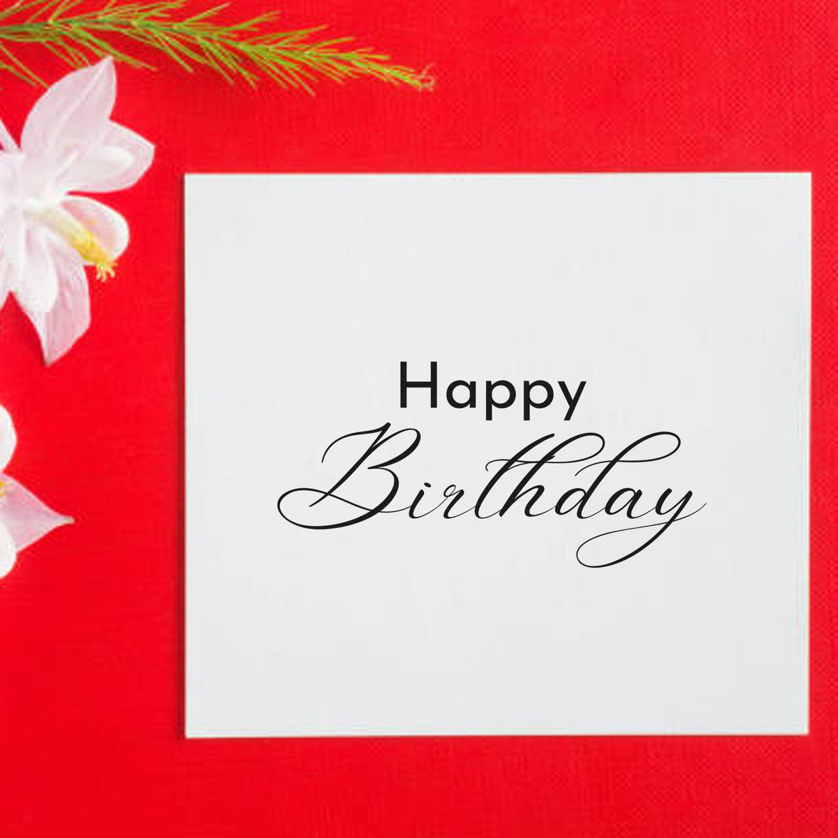 Happy Birthday stamp and seal on white card, black script on bright red background with white flowers.