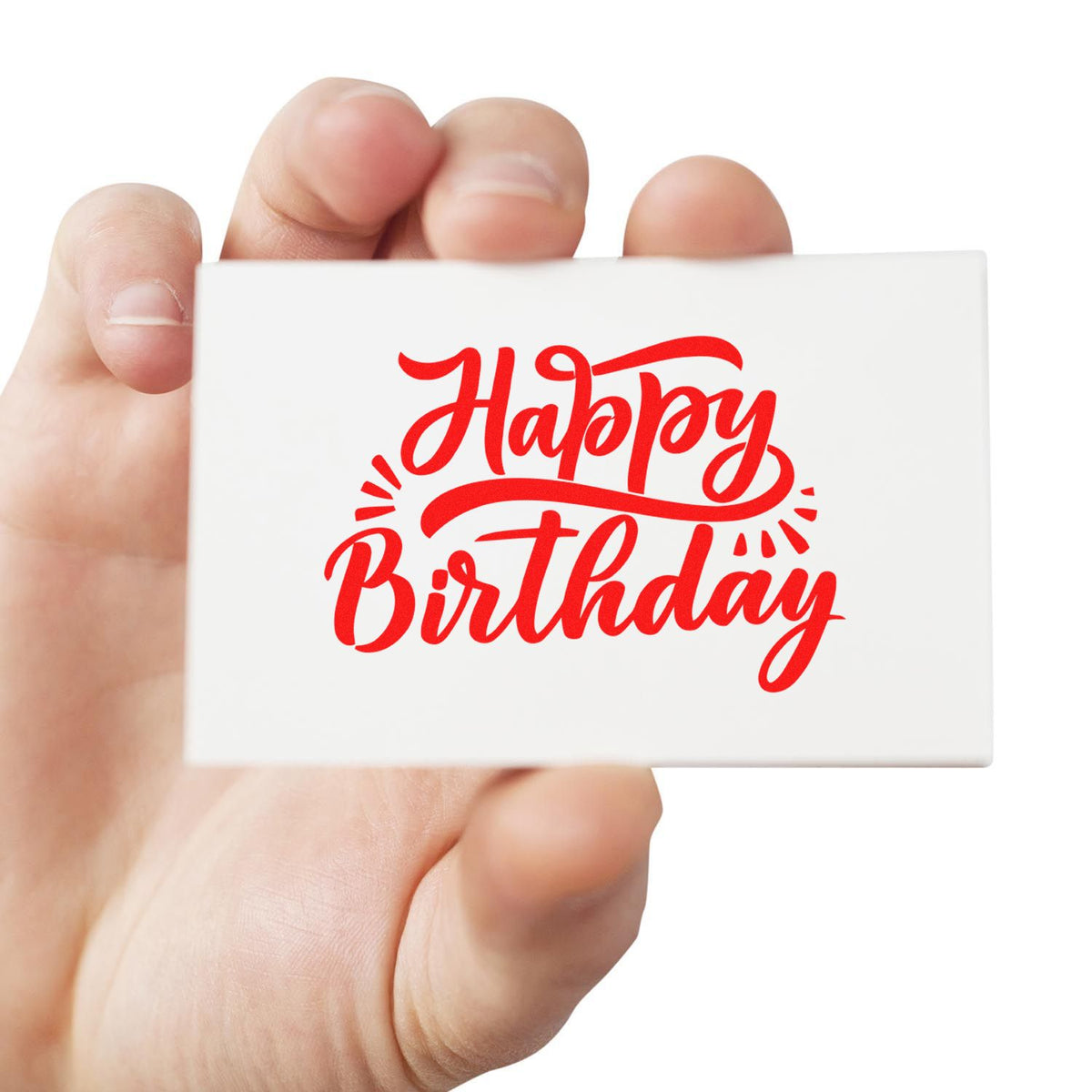 Hand holding white stamp block with red Happy Birthday seal design for custom stamping.