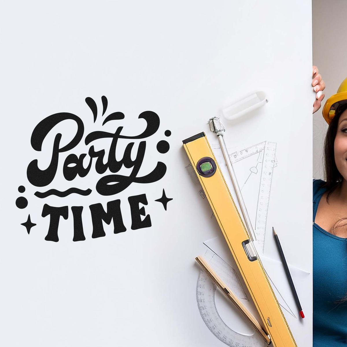 Black Party Time stamp on white board with yellow level, rulers, pencil, and protractor for seal and stamp products.