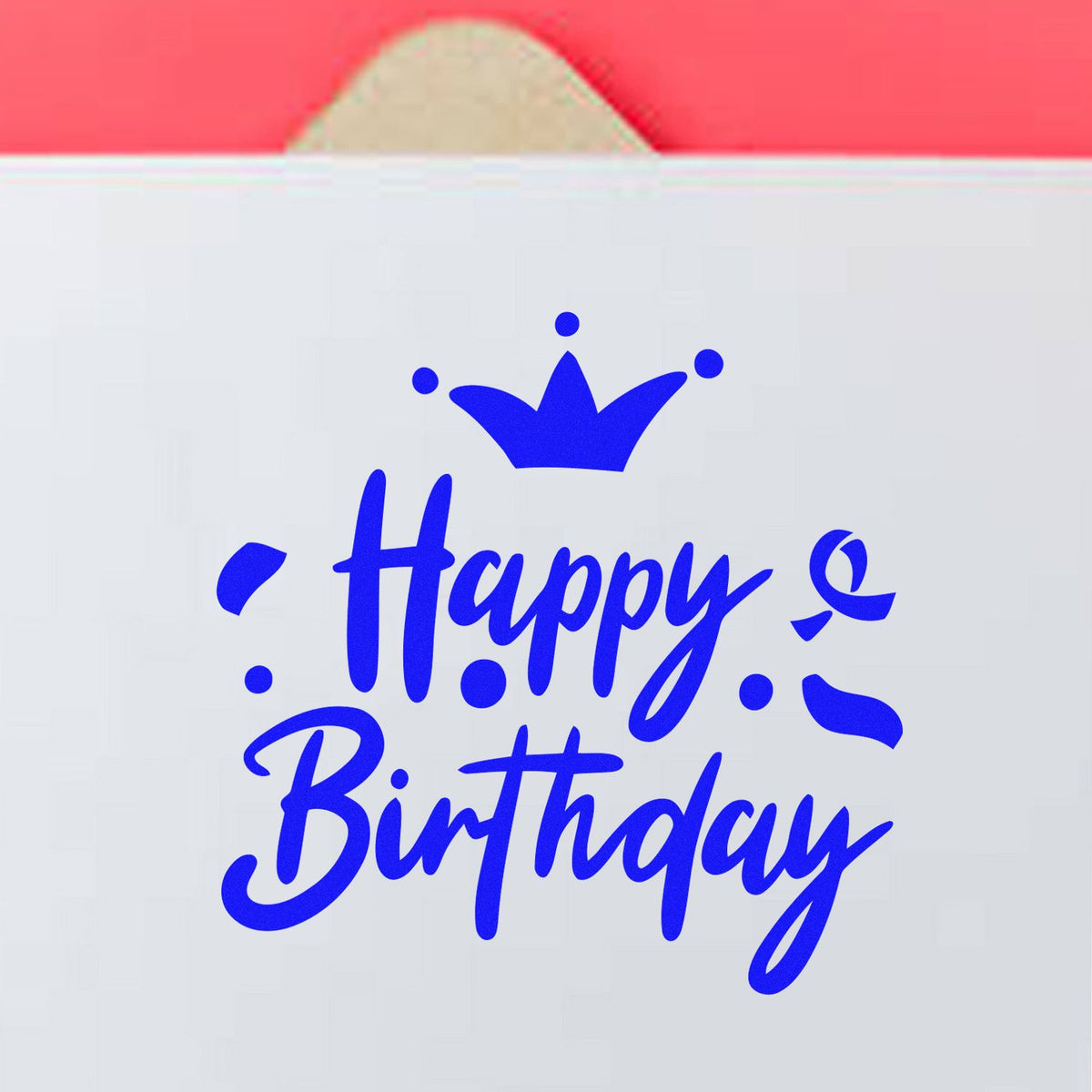 Blue Happy Birthday stamp and seal design with crown on white packaging, set against a pink background.
