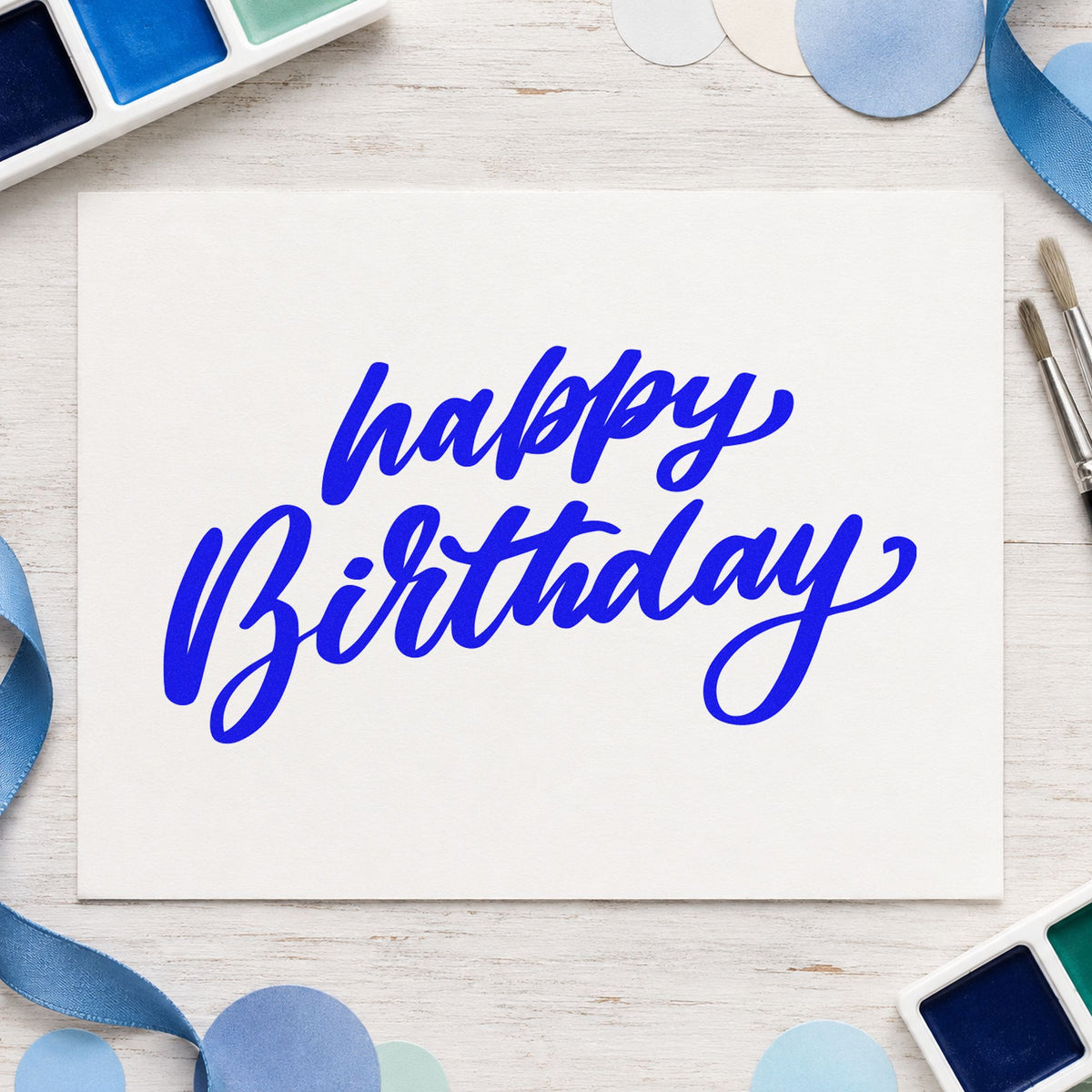 Happy Birthday Slanted Brush craft stamp in blue ink on cardstock, an easy option for service apron printing.
