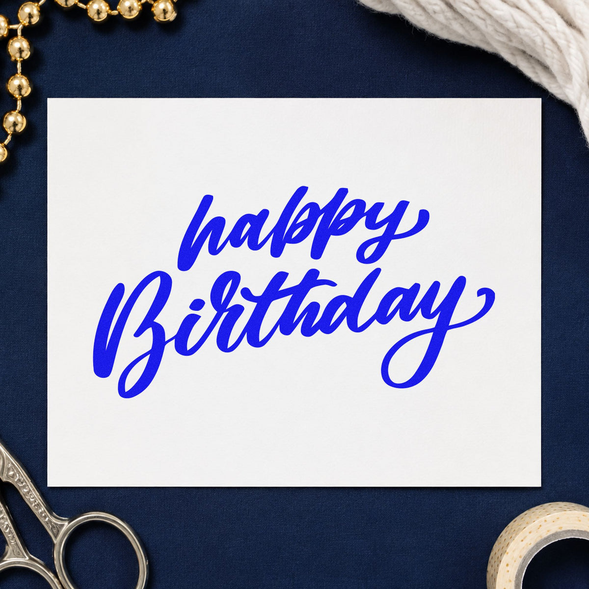 Happy Birthday Slanted Brush craft stamp imprinted in blue ink on paper, a design suited to framed serving hatch.