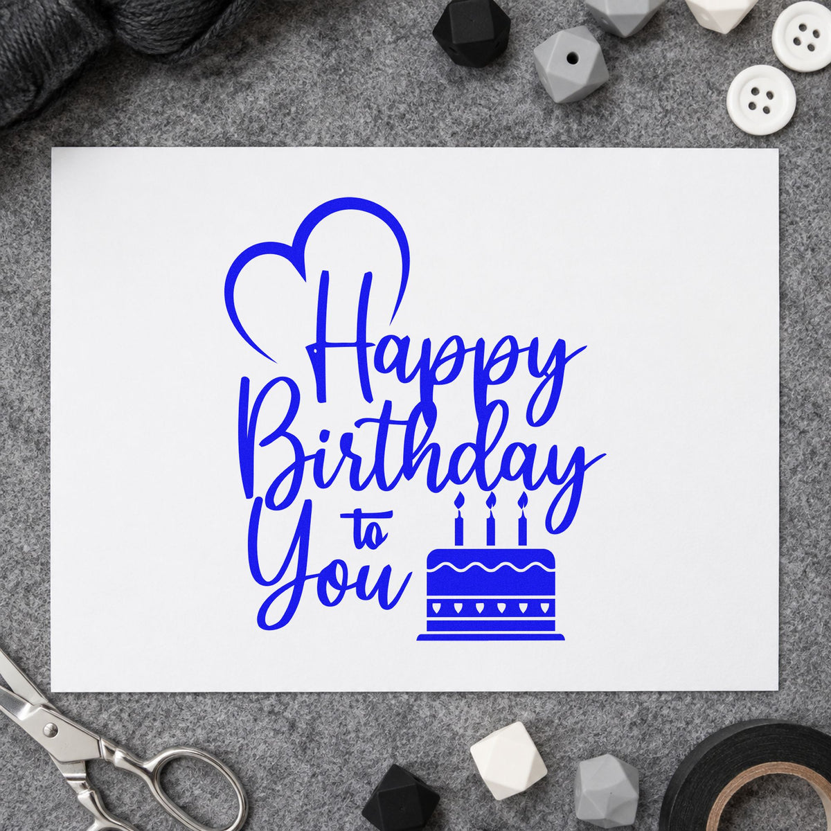 Birthday To You Cake craft stamp in blue ink on cardstock, an easy option for van liner printing.